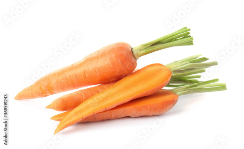 Whole and cut ripe carrots isolated on white