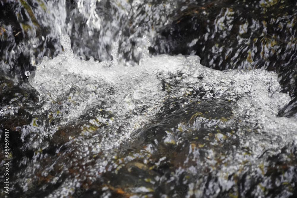 water flowing into the waterfall water flowing into the waterfall