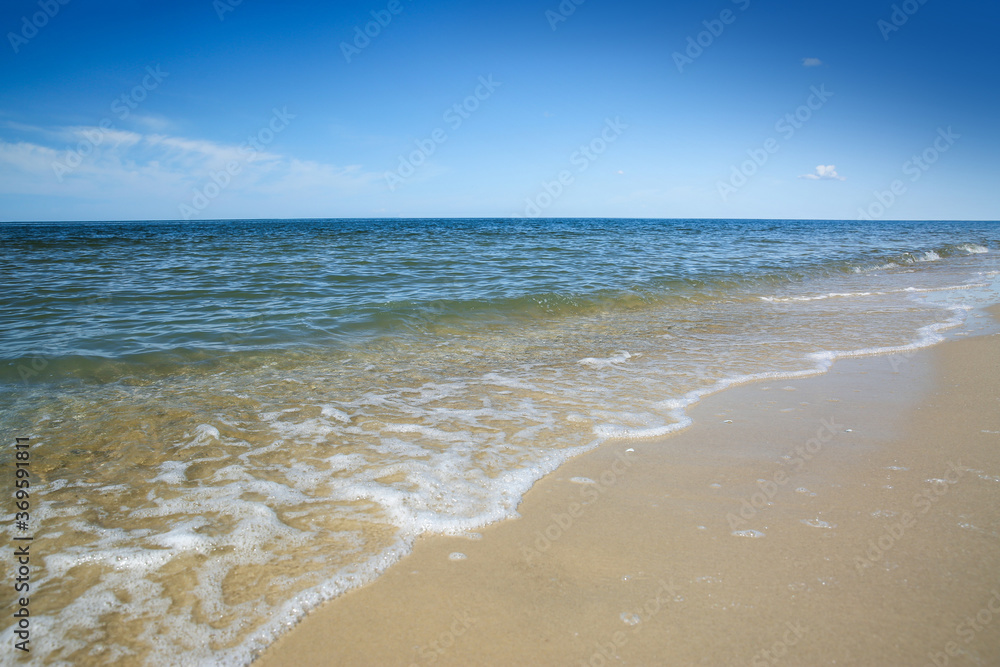 Beautiful view of sandy beach and sea on sunny day