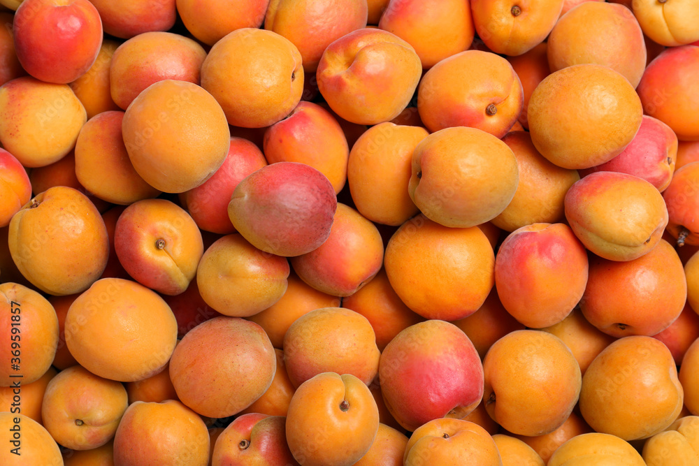 Delicious fresh ripe apricots as background, top view