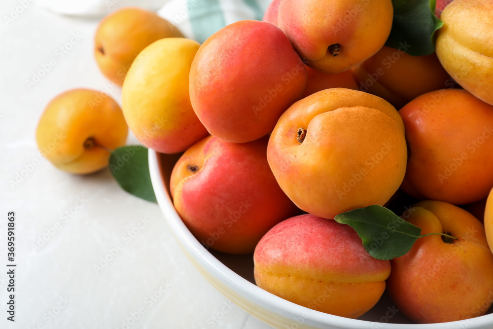 Delicious fresh ripe apricots on white table, closeup Delicious fresh ripe apricots on white table, closeup