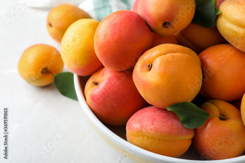 Delicious fresh ripe apricots on white table, closeup