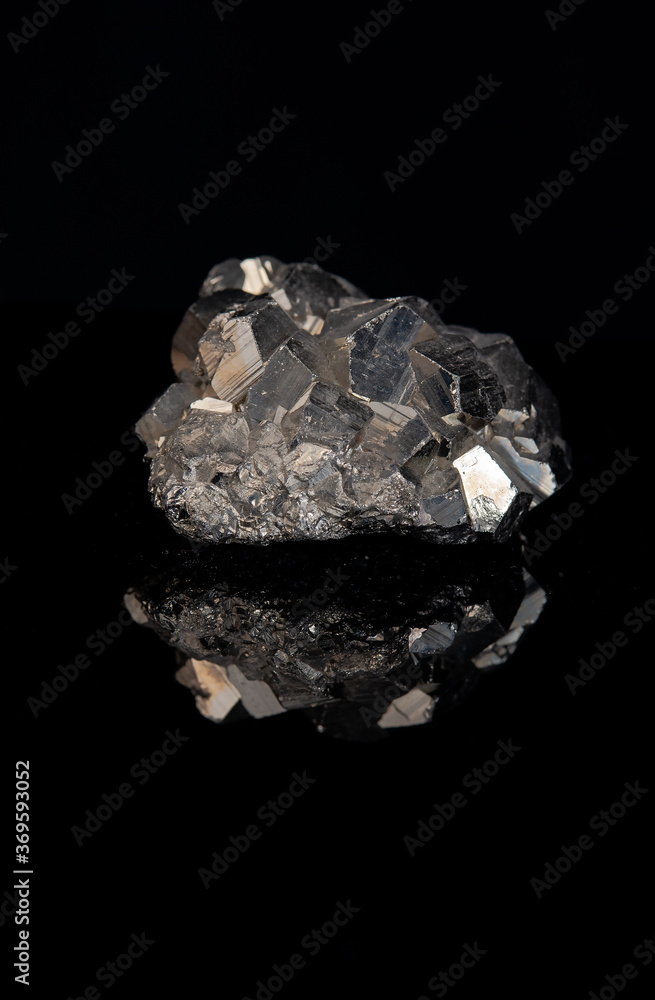 Pyrite with dodecahedron formation on black background