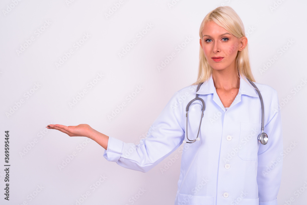 Portrait of young beautiful woman doctor with blond hair Portrait of young beautiful woman doctor with blond hair