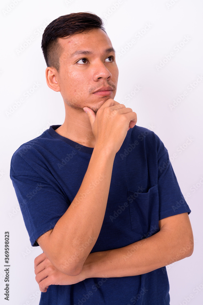 Portrait of young Asian man with beard stubble Portrait of young Asian man with beard stubble