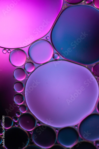Water and oil drops in colour effects light image.