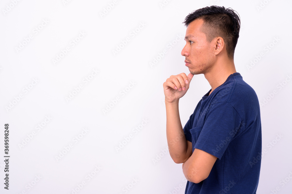 Portrait of young Asian man with beard stubble Portrait of young Asian man with beard stubble
