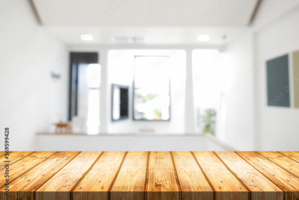 Fototapeta premium Empty wooden desk space and blurry background of home window for product display montage.