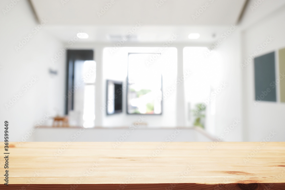 Fototapeta premium Empty wooden desk space and blurry background of home window for product display montage.
