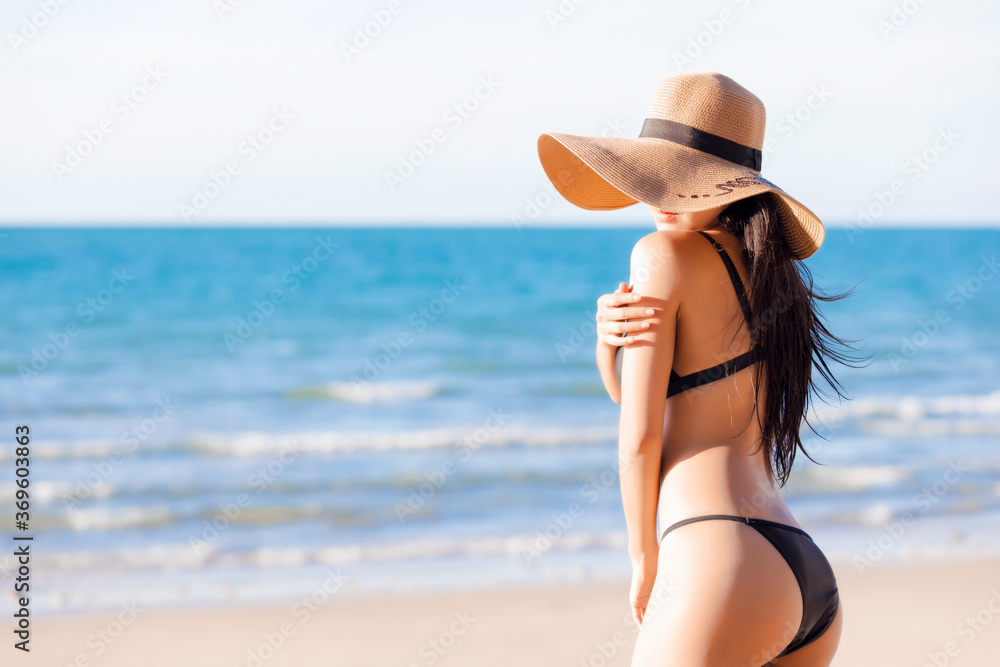 Beautiful sexy asian women in a sexy bikini on tropical beach	