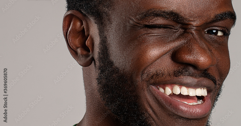 silly funny face close up of guy winking positively to camera Stock Photo |  Adobe Stock