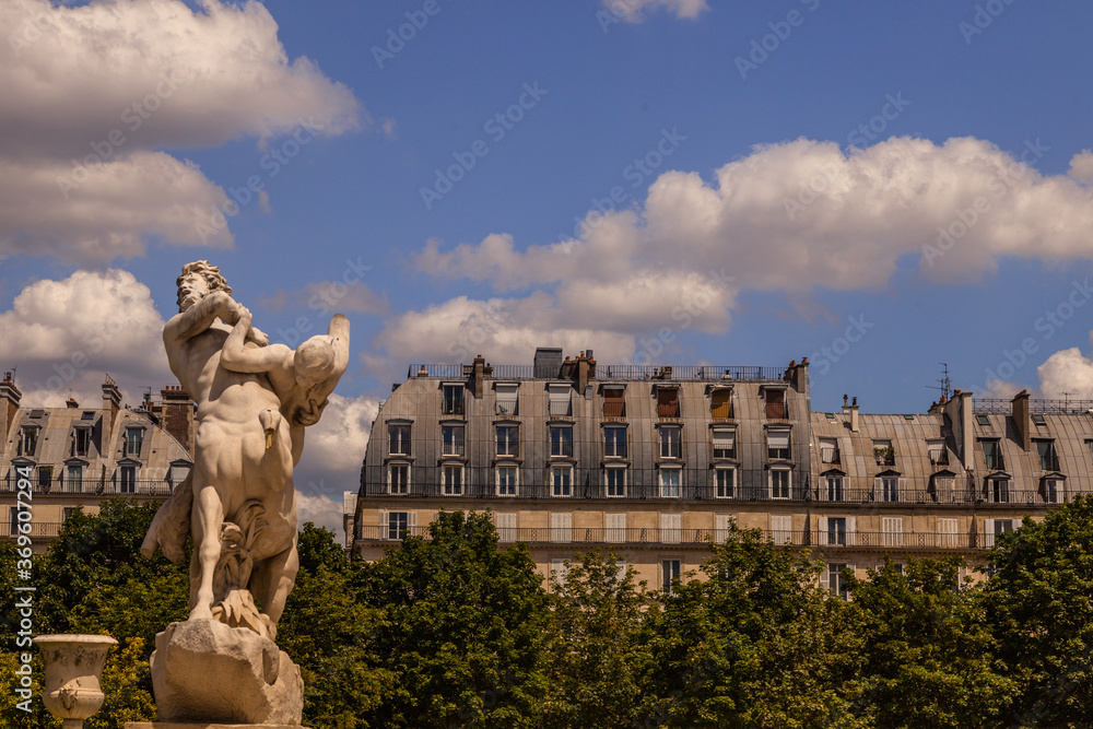 Traditional Paris building seen from the Tuileries Garden