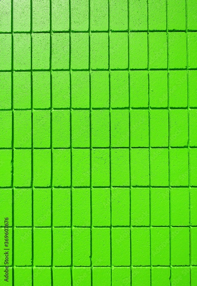 Bright green concrete brick wall background