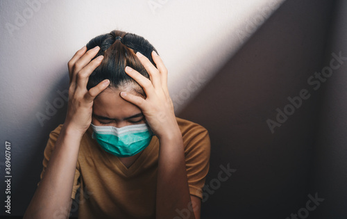 Sadness or depressed woman crying after failure and layoff from work because impact from covid-19 pandemic outbreak. photo