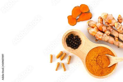 Curcumin powder, Turmeric root with slices, Curcuma capsules and black pepper isolated on white background. photo