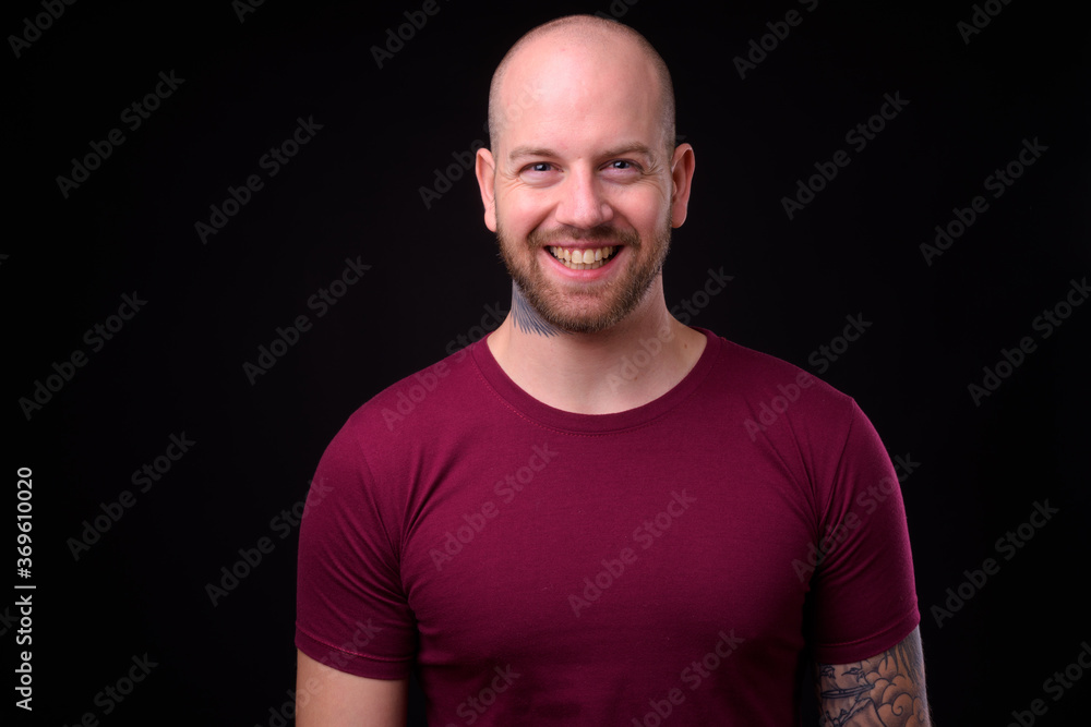 Portrait of happy handsome bald bearded man Portrait of happy handsome bald bearded man
