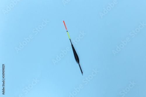 Fishing float on a blue background. Top view