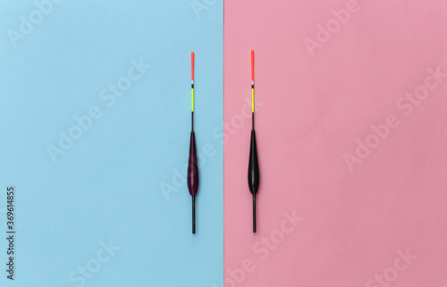 Two Fishing floats on pink blue pastel background. Top view. Minimalism