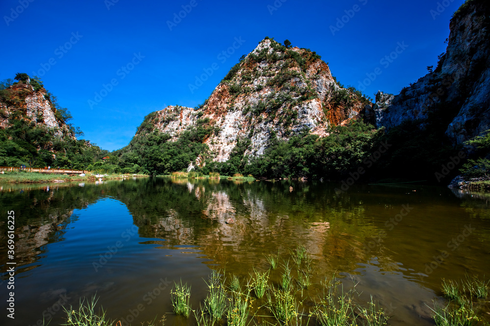 Close-up natural background of atmosphere surrounded by large rocky mountains, natural reservoirs and various trees, the integrity of the ecology