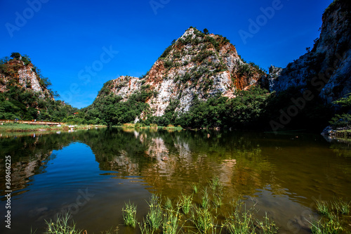 Close-up natural background of atmosphere surrounded by large rocky mountains, natural reservoirs and various trees, the integrity of the ecology