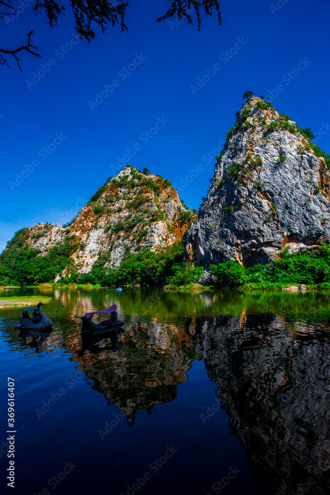 Close-up natural background of atmosphere surrounded by large rocky mountains, natural reservoirs and various trees, the integrity of the ecology