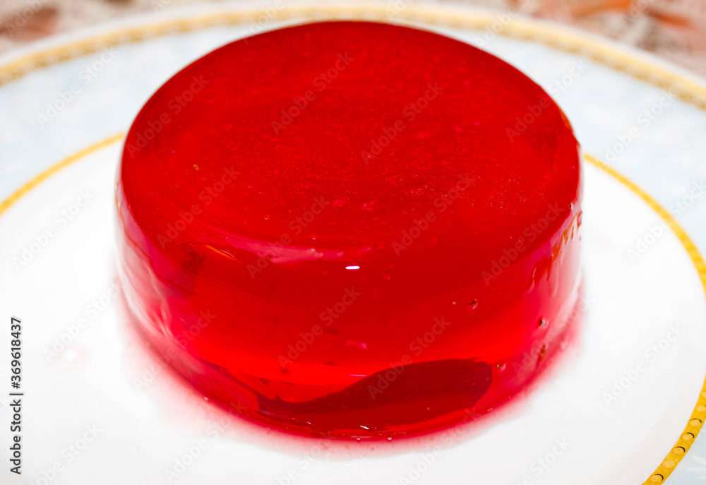 Berry red jelly on a plate, made at home. Photos | Adobe Stock