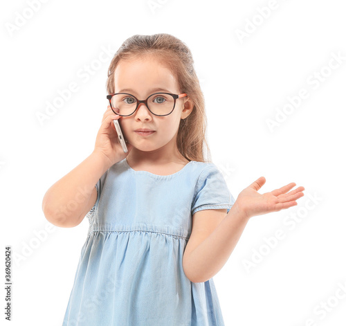 Cute little girl talking by...