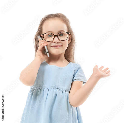 Cute little girl talking by...