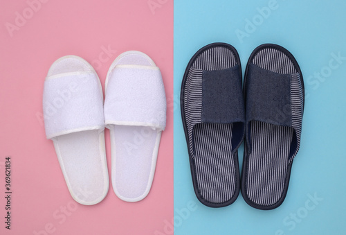 Sleeping room slippers on pink blue pastel background. Top view