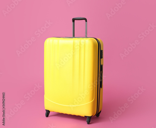 Packed suitcase on color background. Travel concept