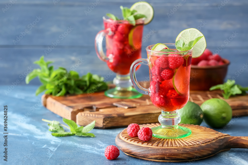 Cup of cold raspberry tea on table - obrazy, fototapety, plakaty 