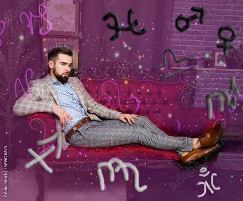 Pensive man and astrological horoscope symbols around him
 photo