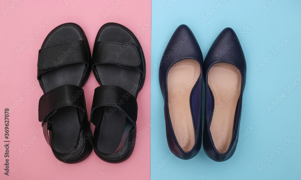 Leather women's sandals and high heel shoes on pink blue background. Top view. Flat lay Leather women's sandals and high heel shoes on pink blue background. Top view. Flat lay