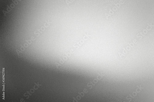 Glowing black silver foil metal wall with copy space, abstract texture background