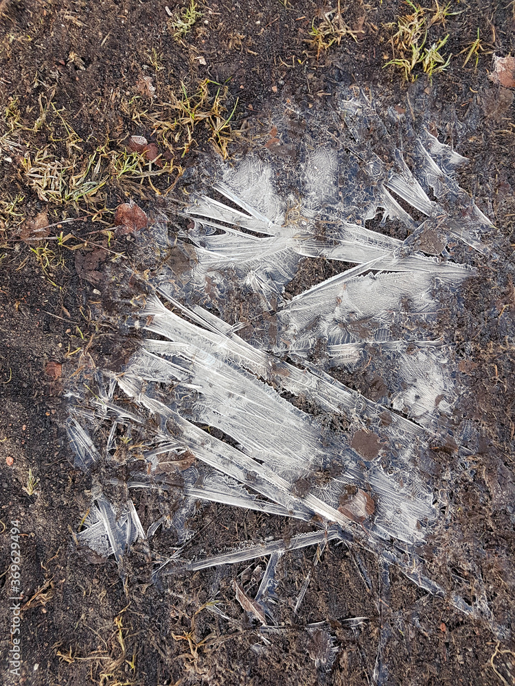 Frost patterns on dirt at winter shot from above. Frost patterns on dirt at winter shot from above.