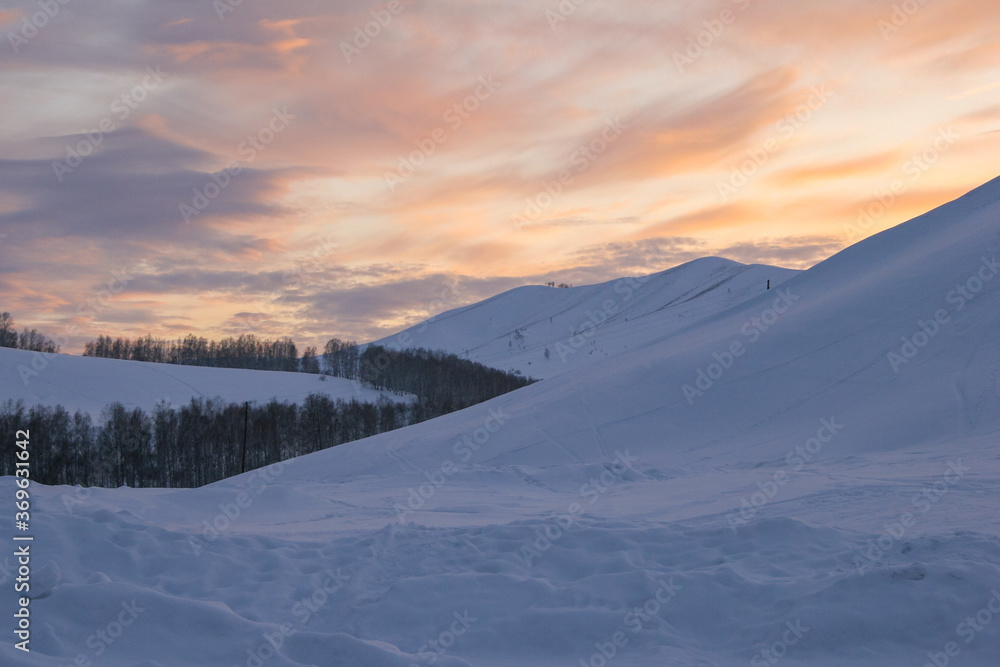 Beautiful sunset in the mountains. Spring in the Altai Mountains. Altai Krai, Russia. Beautiful sunset in the mountains. Spring in the Altai Mountains. Altai Krai, Russia.