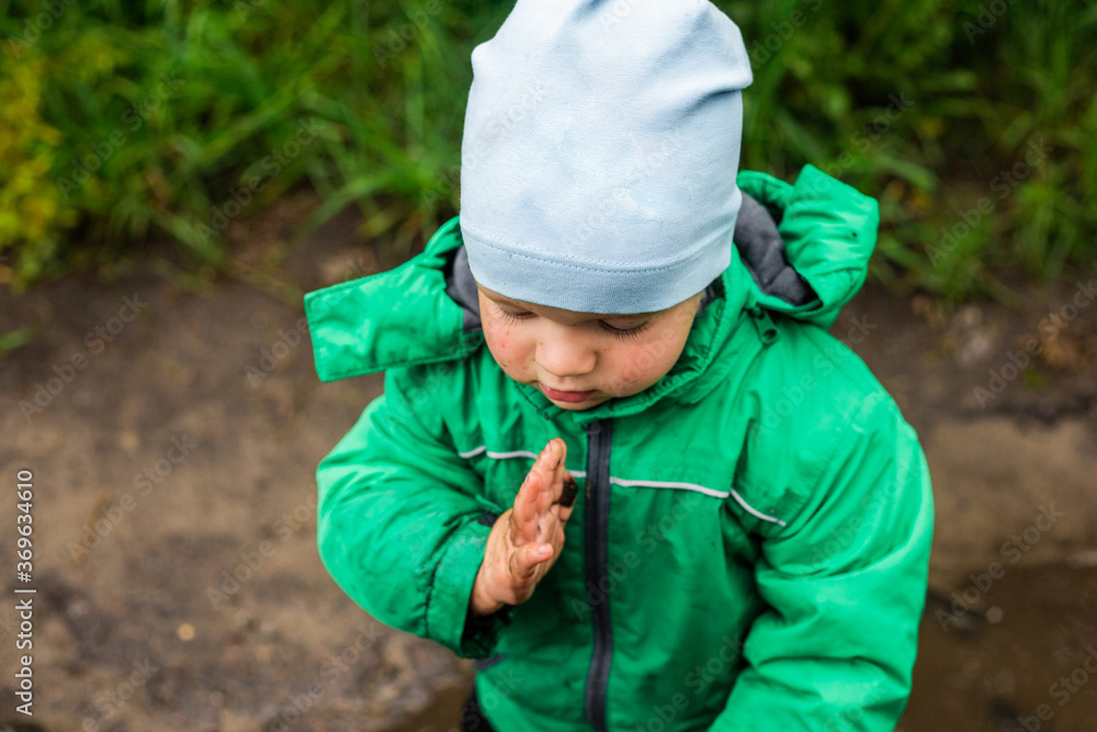 Child. A little boy in a green jacket and red boots plays in the swamp.
Carefree childhood. Happy child concept. Happy childhood.
He screams and laughs, has fun outside in the swamp. Child. A little boy in a green jacket and red boots plays in the swamp.
Carefree childhood. Happy child concept. Happy childhood.
He screams and laughs, has fun outside in the swamp.