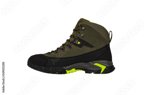 Modern mountain boots isolate on a white back. Shoes for outdoor activities and travel.