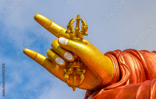 golden hand of Lord Buddha  photo