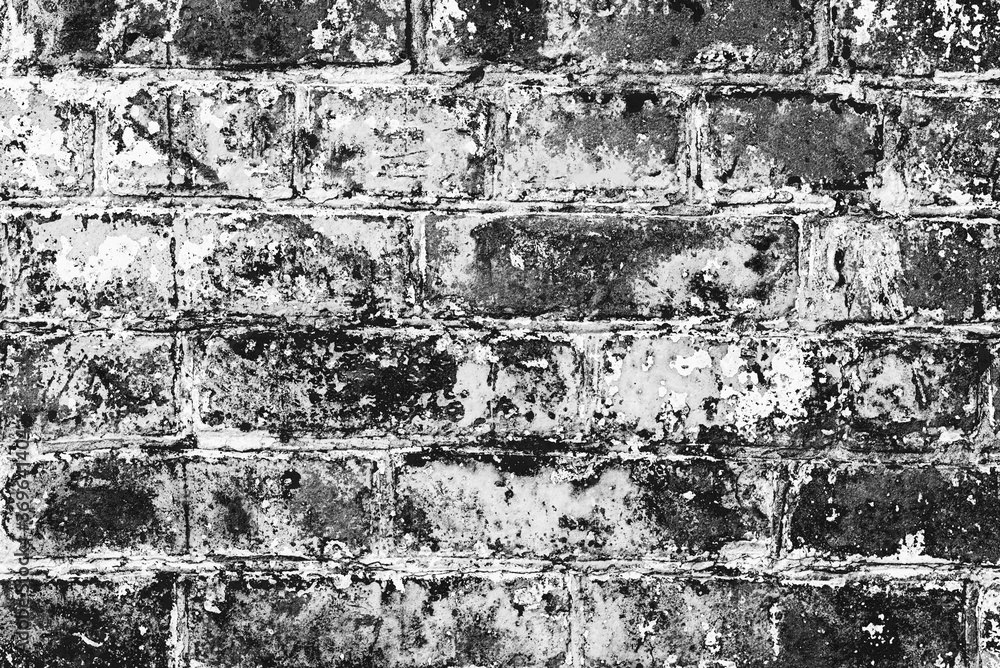 Obraz premium Texture of a brick wall with cracks and scratches which can be used as a background