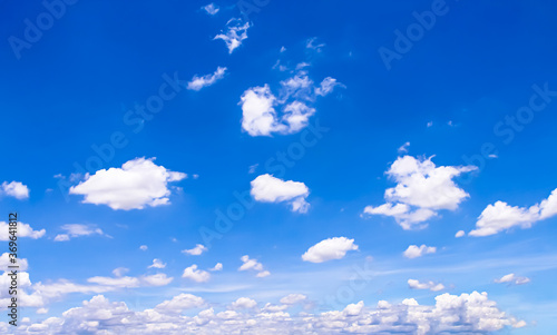 Clouds on bright blue sky natural background