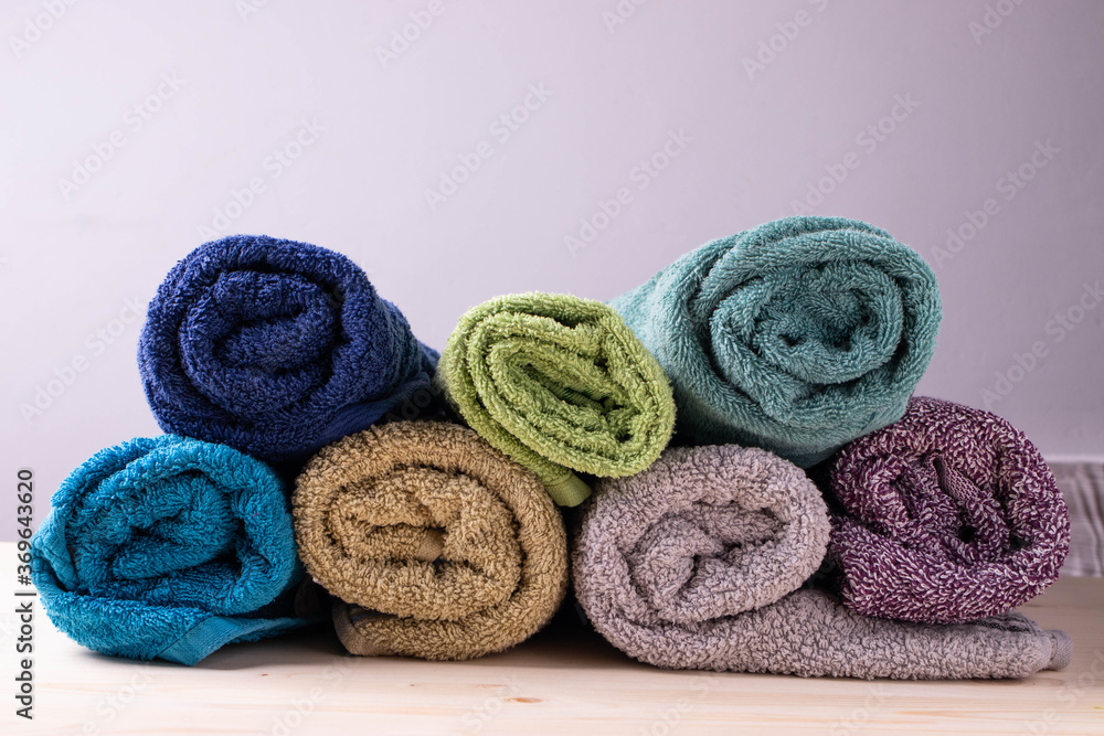a group of bath towels in rolls a group of bath towels in rolls
