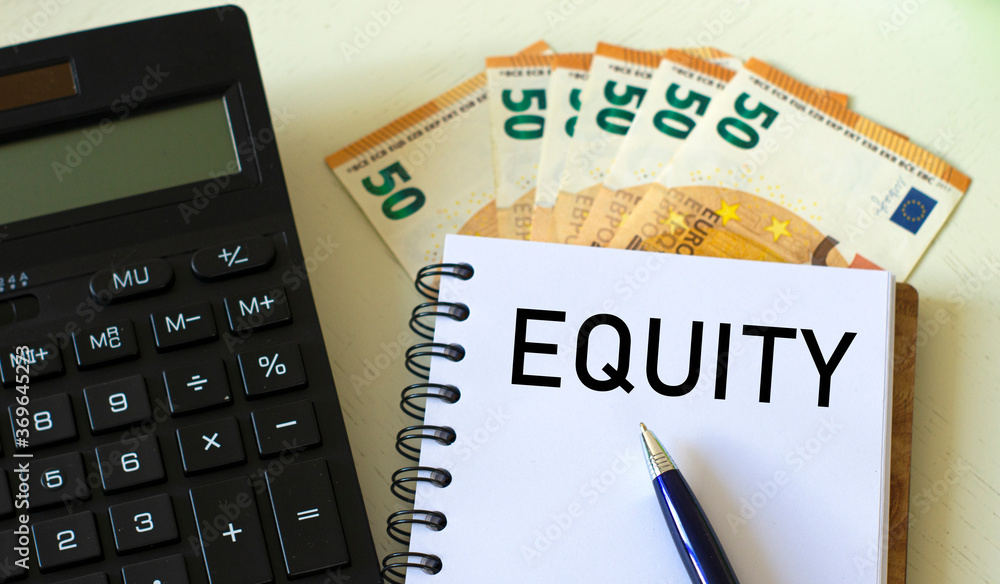 EQUITY word in a notebook against the background of calculitar and banknotes EQUITY word in a notebook against the background of calculitar and banknotes