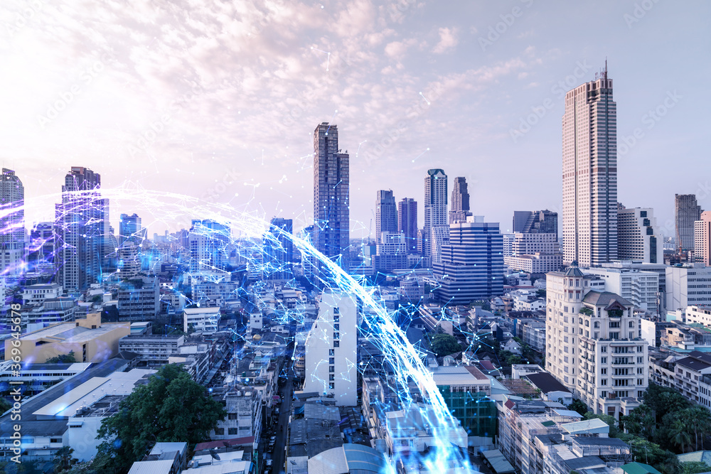 Fototapeta premium Hologram of abstract technology glowing icons, panoramic cityscape of Bangkok at sunset, Asia. The concept of worlds technological changes. Double exposure.