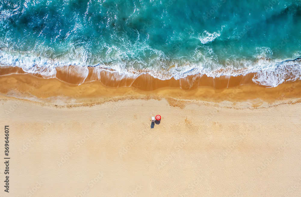 Naklejka premium Tropical beach with colorful umbrellas. Picture with drone!