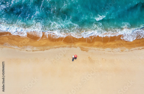 Tropical beach with colorful umbrellas. Picture with drone! photo