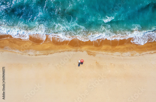 Tropical beach with colorful umbrellas. Picture with drone!