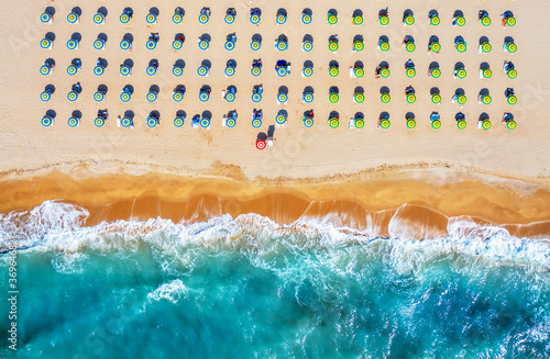 Tropical beach with colorful umbrellas. Picture with drone! photo