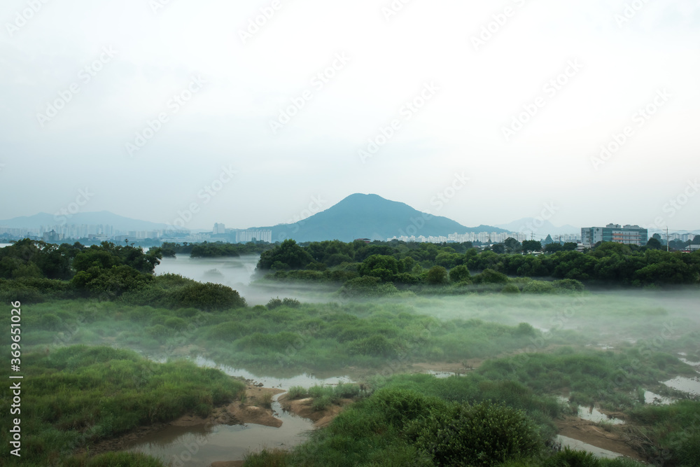 Fantastic landscape of foggy and mist riveside Fantastic landscape of foggy and mist riveside
