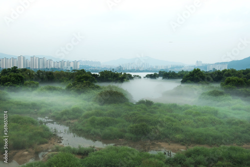 Fantastic landscape of foggy and mist riveside  photo